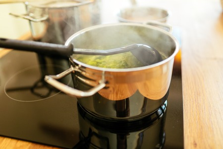 Lunch being made in modern kitchenの写真素材