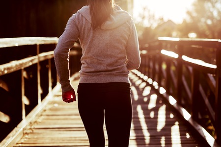 Female jogger exercising outdoorsの写真素材