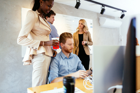 Busiensswoman advising colleagueの写真素材