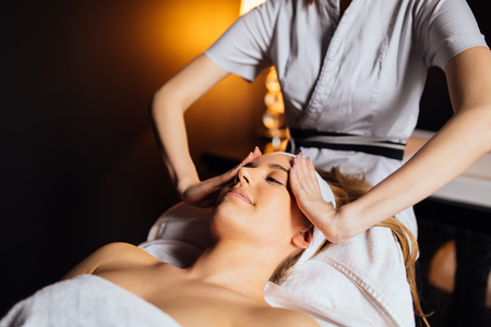 Lovely brunette enjoying massageの写真素材