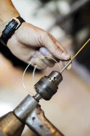 DIY, metal string wrapped around drillの写真素材