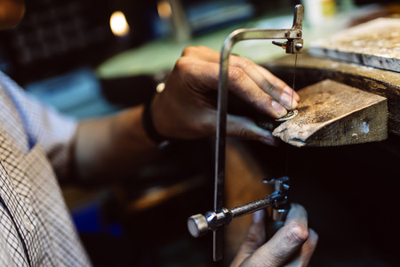 Jeweler crafting jewelryの写真素材