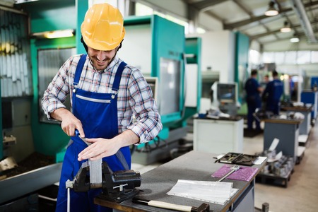 Portrait of an handsome engineer in a factoryの写真素材