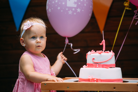 Portrait of little girl at birthday partyの写真素材