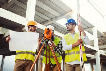 Portrait of construction engineers working on building siteの写真素材