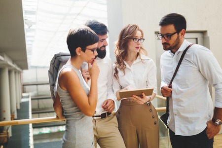 Group of young perspective businesspeople having discussion