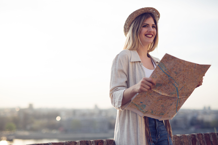 Happy female tourist sightseeing and exploring