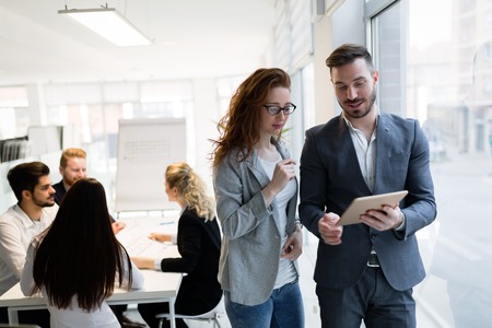 Young attractive architects using digital tablet in officeの写真素材