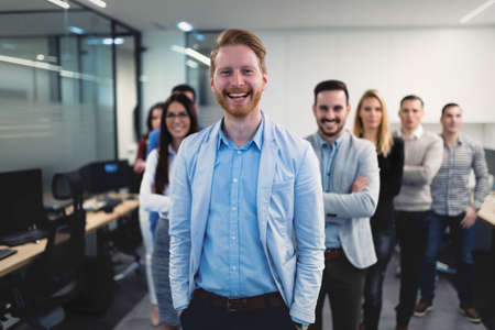 Successful team of young perspective businesspeople in officeの写真素材