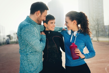 Friends fitness training together outdoors living active healthyの写真素材