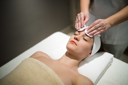 Facial massage treatment by professionalの写真素材