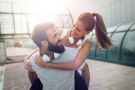 Portrait of young attractive happy fitness coupleの写真素材