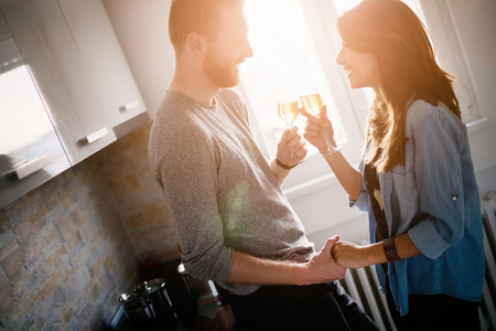 Young couple in love celebrating moving into new homeの写真素材