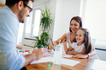 Happy familiy spending fun time at homeの写真素材