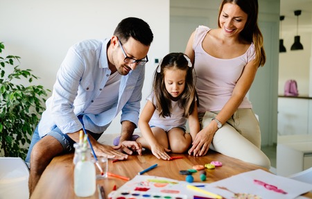 Happy familiy spending fun time at homeの写真素材