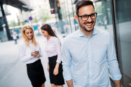 Portrait of handsome young businessman on streetの写真素材