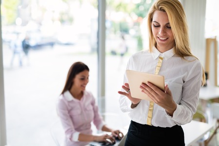 Portrait of young beautiful smiling blonde womanの写真素材