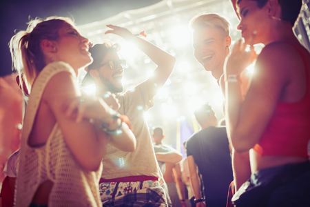 Group of friends having great time on music festivalの写真素材