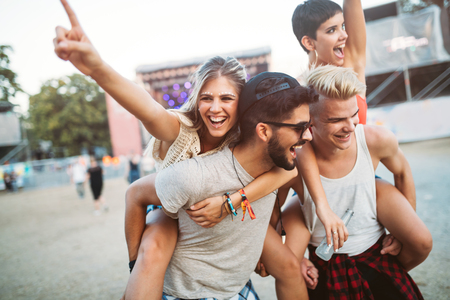 Group of friends having fun time at music festivalの写真素材