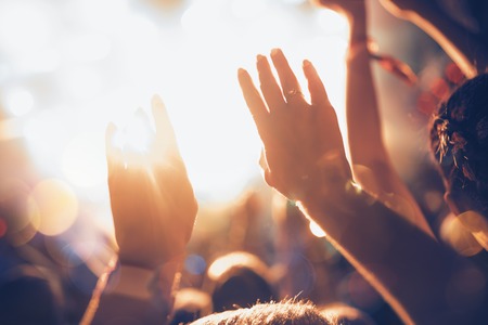 Portrait of happy crowd enjoying at music festivalの写真素材