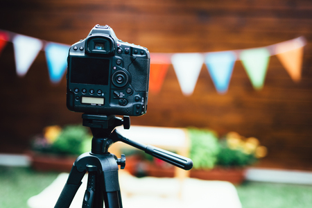 Picture of digital camera placed on tripodの写真素材