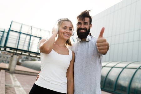 Portrait of young attractive happy fitness coupleの写真素材