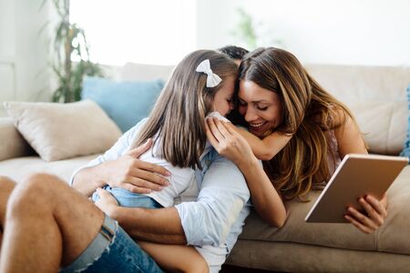 Happy familiy spending fun time at homeの写真素材