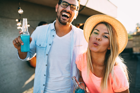 Happy couple having fun time at partyの写真素材