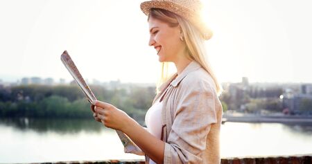 Tourist woman looking at map
