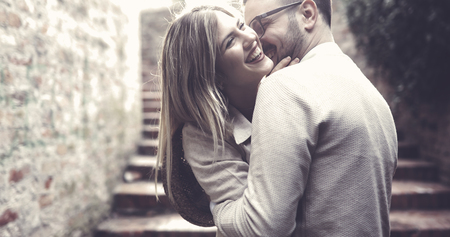 Young happy couple is enjoying outsideの写真素材