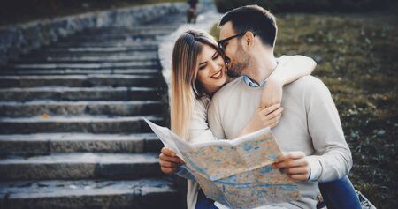 Tourist couple using map as guideの写真素材