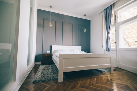 Picture of bedroom in soft light colors and comfortable bedの写真素材