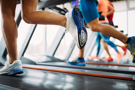 Picture of people running on treadmill in gymの写真素材