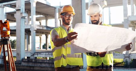 Team of architects people in group on construciton site