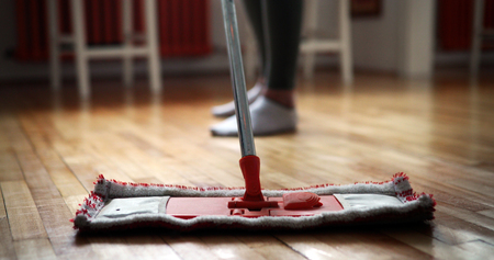 Woman using mop cleaner to do household chores fasterの写真素材