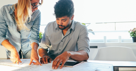 Business People and architects working on project together