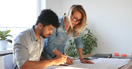 Business People and architects working on project together