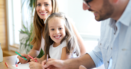 Happy familiy spending fun time at homeの写真素材