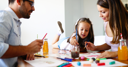 Happy familiy spending fun time at homeの写真素材