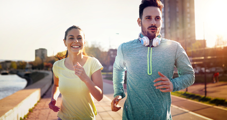 Friends fitness training together outdoors living active healthyの写真素材