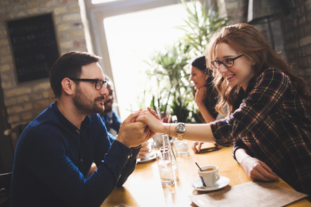 Couple eating out and dating in restaurantの写真素材