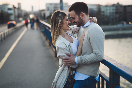 Happy romantic couple hugging and smilingの写真素材