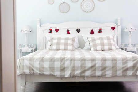 Picture of comfortable double bed in bedroomの写真素材