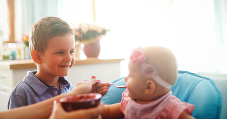 Happy young family, mother with two childrenの写真素材