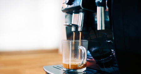 Coffee machine making beautiful coffee in morning with cremaの写真素材