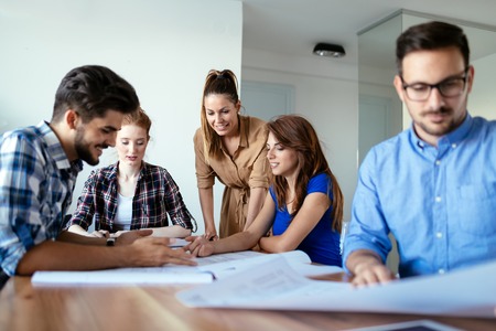 Image of business partners discussing documents and ideasの写真素材