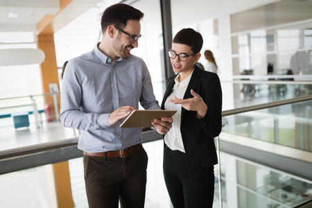 Corporate teamworking colleagues in modern officeの写真素材