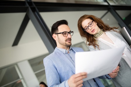 Corporate teamworking colleagues in modern officeの写真素材