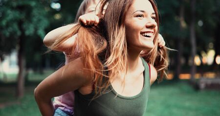 Little girl with special needs enjoy spending time with motherの写真素材