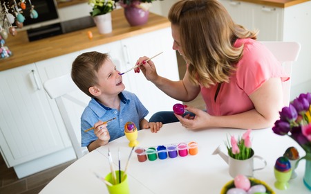 Happy Family Painting Easter Eggsの写真素材